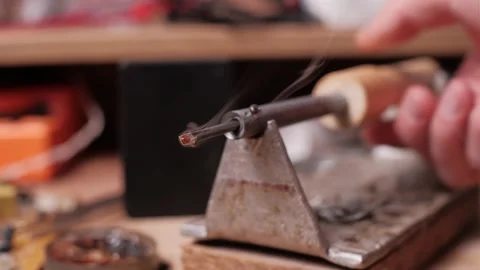 Smoking Soldering Iron Tip Heating on Metal Stand Video stock 306045367