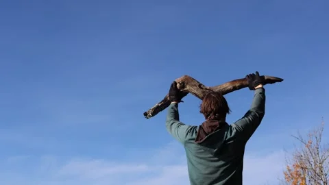 Smoking timber held by man in the air. Stock Footage 296822271