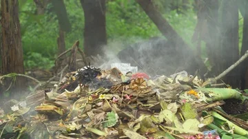 Smoking trash bin. Burning rubbish, Asia Stock Video Pond5
