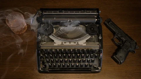 Smoking Typewriter with Gun Stock Footage 107445111