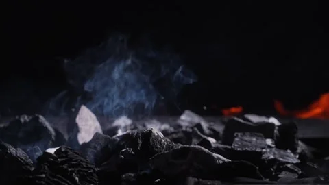 Smoky charcoal with flame in background 스톡 동영상 329918429