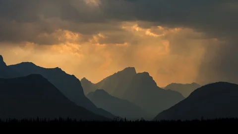 Smoky clouds at sunset in the mountains time lapse 8K Stock Footage 107958404