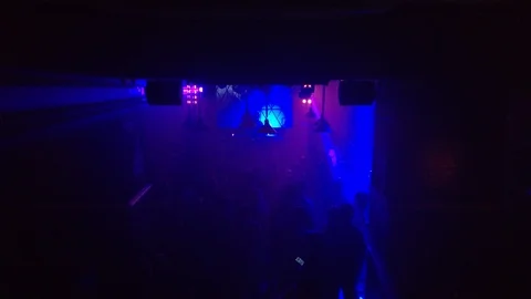 Smoky dance floor of an underground techno club with rays of light 스톡 동영상 88209288