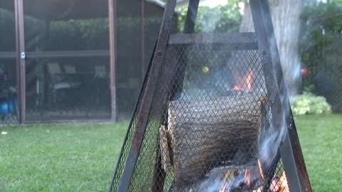 Smoky Firepit in Backyard Stock Footage 107744630