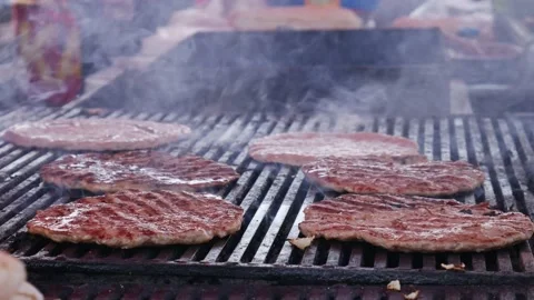 Smoky hamburger meat grilling for burgers. Stock Footage