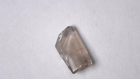 Smoky quartz on a turn table Stock Footage 147146143