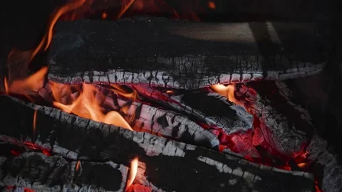 Smoldering and burning logs and in the fireplace Stock Footage 220880601
