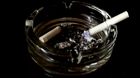 Smoldering cigarette in an ashtray Video stock 47241332