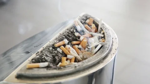 Smoldering cigarette in ashtray Stock Footage 78876084