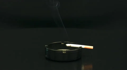 Smoldering cigarette time lapse on turntable 4K 50 fps Stock Footage 46501154