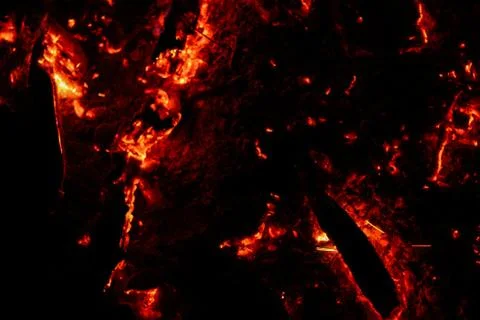 Smoldering coals on a black background Stock Photos