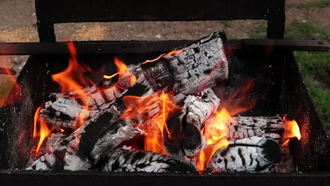 Smoldering coals in a rusty and old charcoal grill Stock Footage 161148895