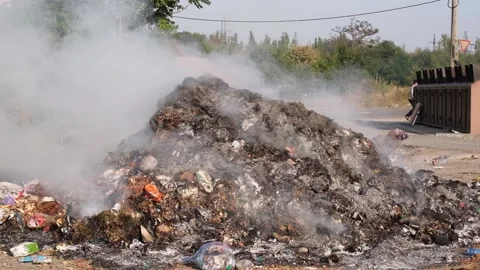 Smoldering garbage at a dump in the city. Stock Footage 139827905