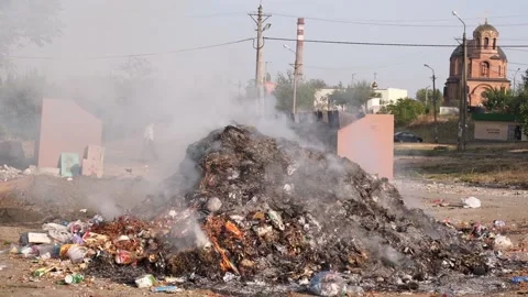 Smoldering garbage at a dump in the city. Stock Footage 139869830