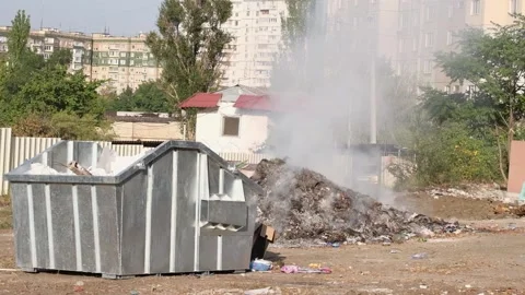 Smoldering garbage at a dump in the city. Stock Footage 139869931