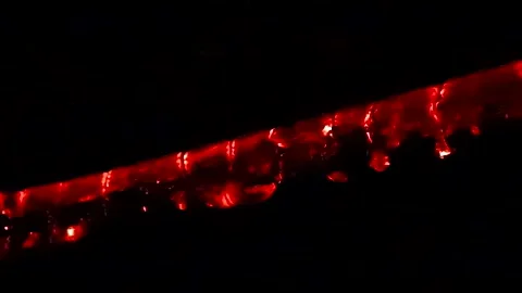 Smoldering Heat and Burning Log in a Fireplace. Sparks on a Black Background Stock Footage 247456919