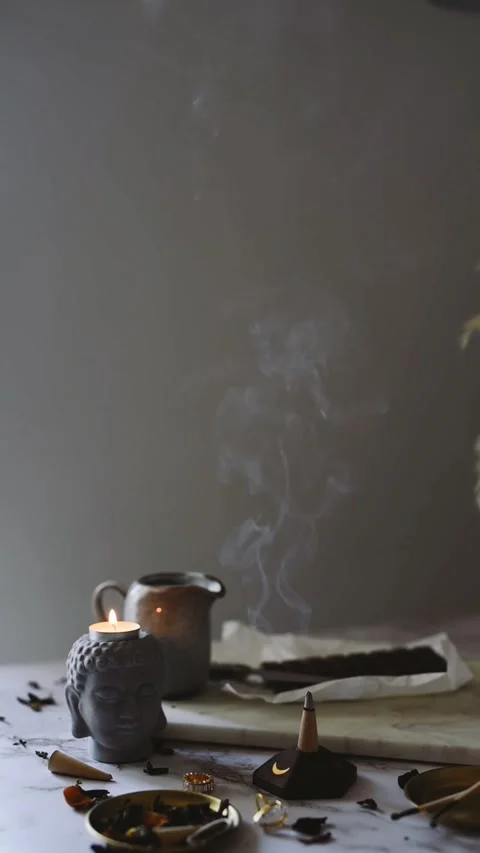 Smoldering Incense and Candle on Rustic Table Video stock 327044020