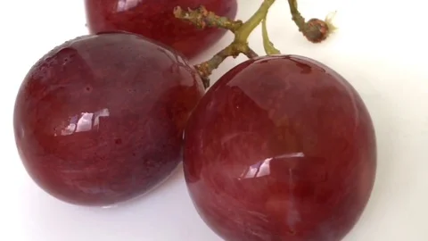 Smoll Red Grapes White background wet water droplet, authentic motion rain water Stock Footage 80718449