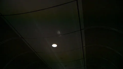 Smooth 180 degrees dolly shot on moving sidewalk through futuristic tunnel Stock Footage 42490848