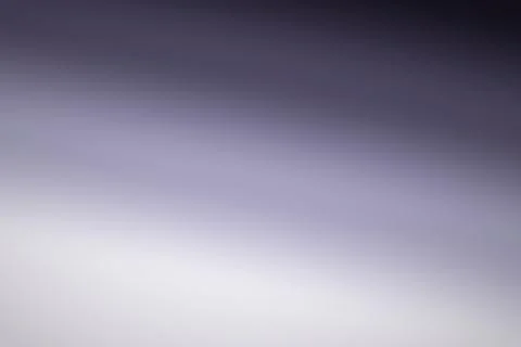 A smooth abstract gradient transitions from deep gray at the top to pale la.. Stock Illustration