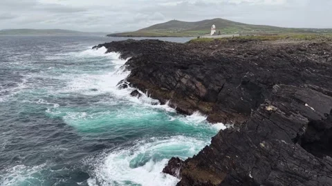 Smooth aerial drone approach from the side toward Ballyglass Lighthouse Stock Footage 342736210