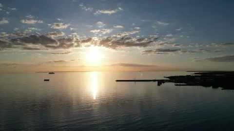 Smooth aerial drone shoot over calm Tallinn Baltic sea in the sunset Stock Footage 310225535