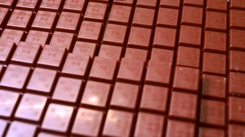 Smooth aerial glide over endless chocolate bars. Stock Footage 323395439