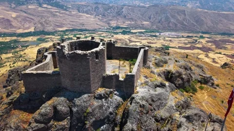 Smooth Aerial Orbit Around Ancient Stone Fortress with Vast Plains Stock Footage 339580647