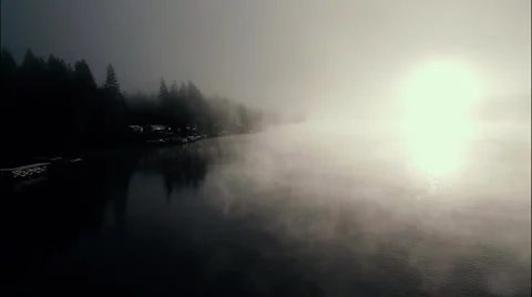 Smooth Aerial Perspective over Donner Lake during a Foggy Sunrise Stock Footage 46271476