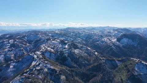 Smooth Aerial Pullback From Snowy Mountains at Constant Altitude Stock Footage 342843438