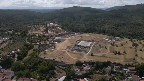 Smooth aerial tracking over Conímbriga revealing layout of Roman structures Stock Footage 341482999