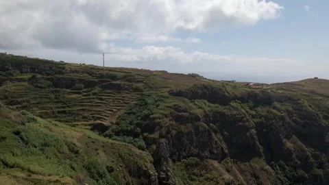 Smooth aerial tracking shot along the cliffside golf course, highlighting Stock Footage 345690891
