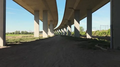 Smooth Aerial under A11 Bridge and Waterway | FlyLens Cinematic Drone Stockbeeldmateriaal 308875859