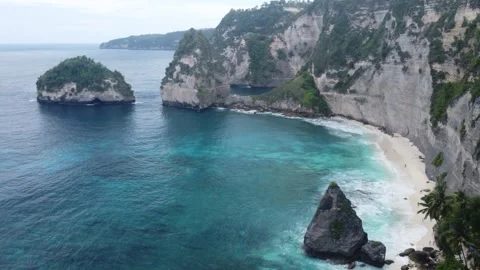 Smooth Aerial View of Diamond Beach, Nusa Penida, Bali, Indonesia, Droneshot  Stock Footage 245753571