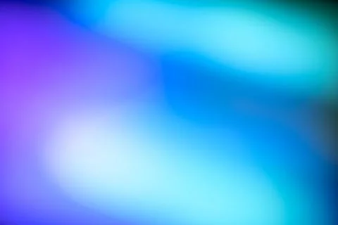 Smooth and blurry gradient background featuring a blend of purple, blue, an.. Stock Photos