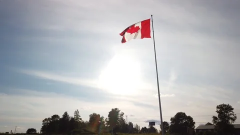 Smooth and steady slow motion shot of a Canadian flag pole during summer Stock Footage 119660607