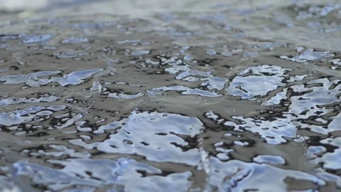 Smooth application of bituminous waterproofing putty is seen on a rough concrete Stock Footage 316208899