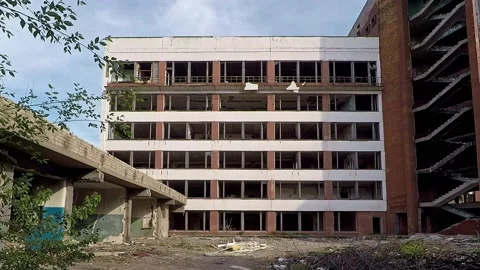 Smooth approach to an abandoned building with no windows Stock Footage 130175941