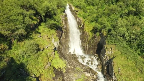 A smooth approach to a large waterfall in the middle of the forest. A strong Stock Footage 269298452