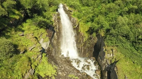 A smooth approach to a large waterfall in the middle of the forest. A strong Stock Footage 269298727
