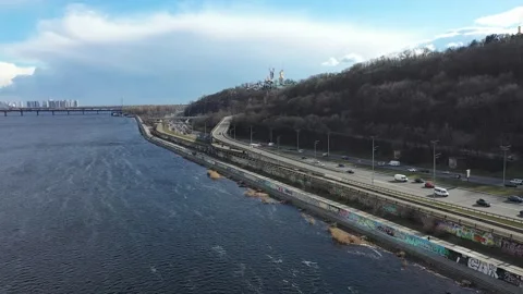 A smooth approach over the Dnieper River to the right bank of Kyiv and a view of Stock Footage 219743593