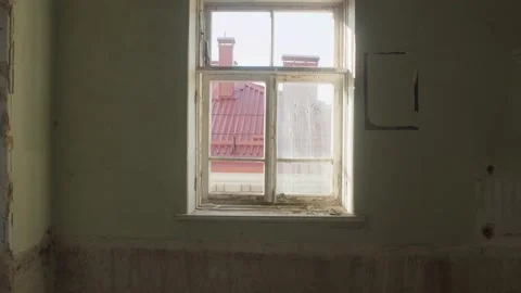 Smooth approach to the window in an abandoned building Video stock 157287944