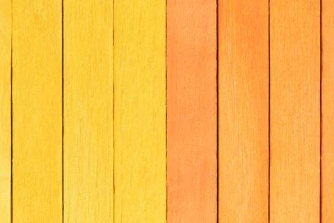 Smooth background from orange and yellow wooden planks. Fotos de archivo