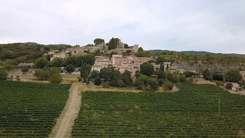 Smooth backwards Drone shot of Goult Village in Provence. Taken on a cloudy day. Stock Footage