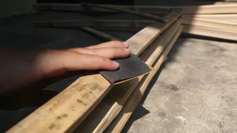 Smooth the bamboo with sandpaper Stock Footage 248529280