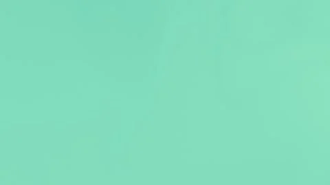 Smooth beige gradient background with soft curves. Seamless loop, 4K. Stockbeeldmateriaal 309956792