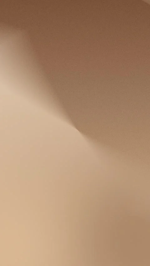 Smooth beige gradient light and shadow forms create a soft, seamless loop Vídeo Stock 309956495