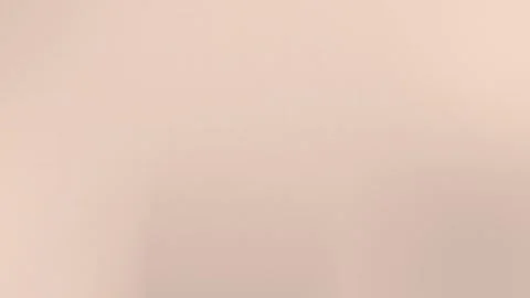 Smooth beige gradient with subtle grid texture, ideal for seamless loop Stock Footage 309701683