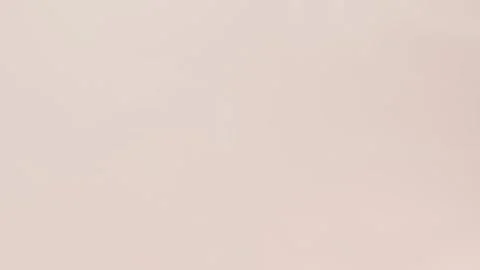 Smooth beige gradient with subtle transitions. Seamless loop background. 4K. 動画素材 309956807