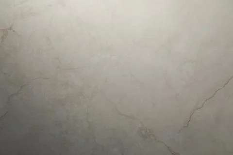Smooth beige marble surface with subtle texture and veining patterns in natural 스톡 사진